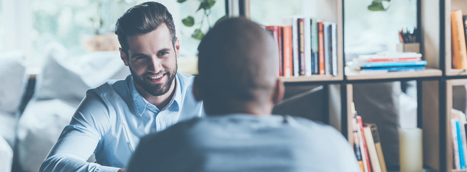 Job interview. Two young men in smart casual wear sitting at the marketing interview"